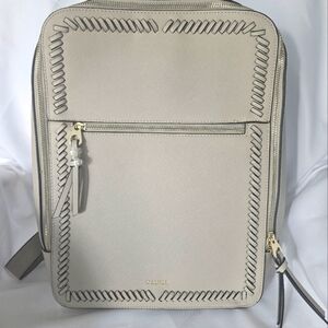 CALPAK LUGGAGE BACKPACK. LIGHT TAN.